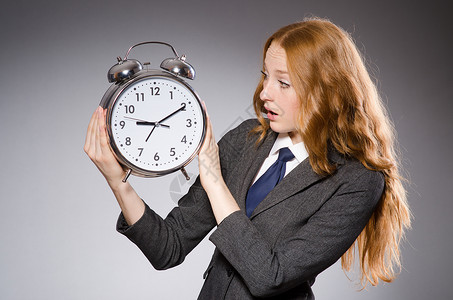 时钟迟到的女商人图片