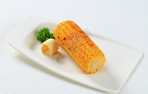 烤玉米棒和黄油图片