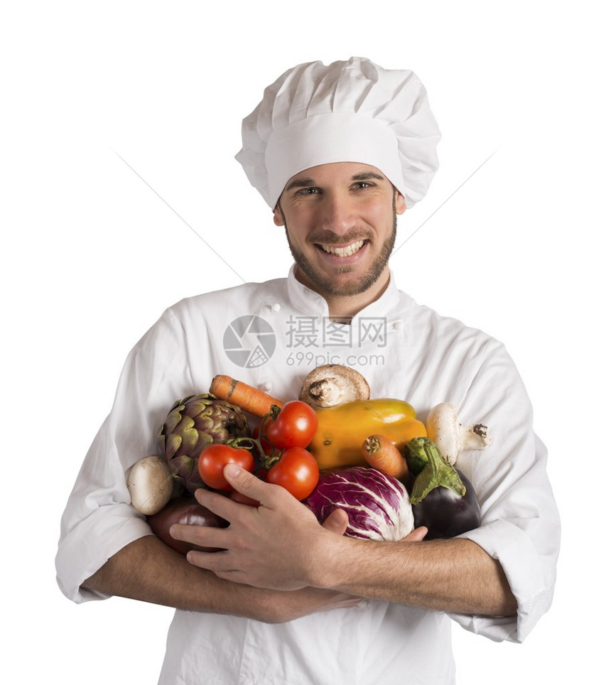 以新鲜蔬菜烹制素食的厨师图片
