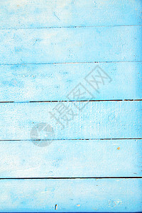 蓝色木门上的钉子剥落了油漆生锈了图片