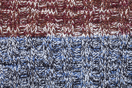 蓝白色黑棕褐色红混合编织布由加热的缝线背景图片