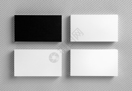 灰色背景上的空白黑名片品牌标识的样机平面设计师作品集的图片