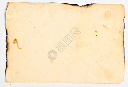 旧纸有肮脏的污渍烧焦的边缘在白背景图片