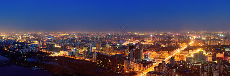 北京在夜间鸟瞰图与城市建筑背景图片