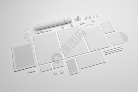 白色的品牌样机模板集一套带有平板电脑A4信笺购物袋手机和cd的品牌文具模型背景图片