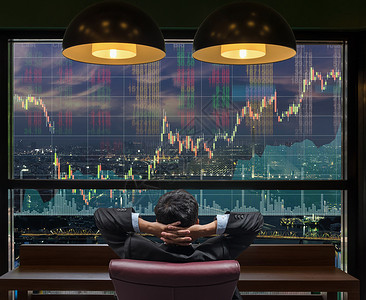 在大屏幕背景商业交易和金融概念上查看城市景观的股票交易图表的坐图片