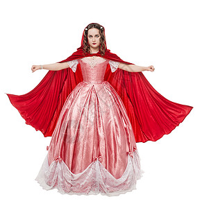 穿着长中世纪长裙和白衣的红斗图片