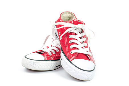 白色背景上的红色运动鞋图片