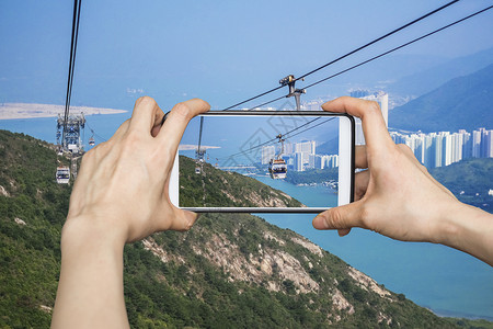 在香港公园的有线汽车里手机智能手机上拍图片
