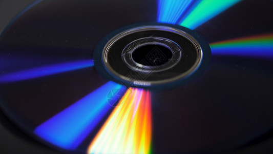光盘或dvds的背景光盘DVD上的眩光图片