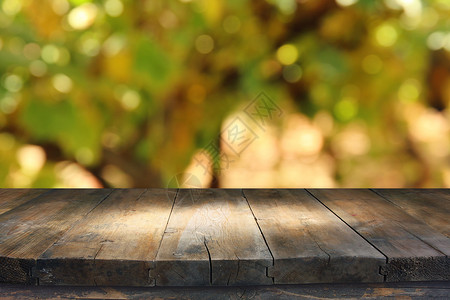 在模糊的葡萄园景观前的木制桌图像准备用于图片