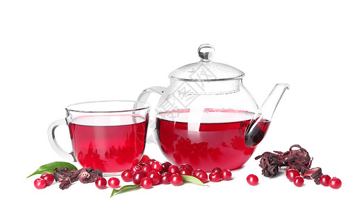 玻璃杯和壶中的红茶白色背景的蔓越莓图片