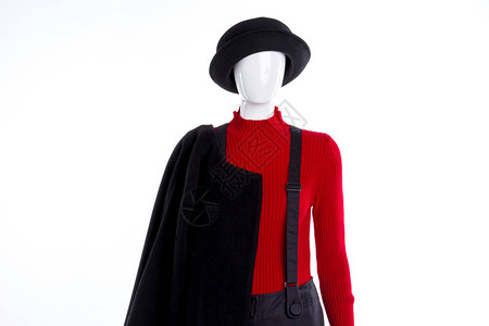 黑帽子和红毛衣戴着时装头饰裤子和外套的女模特儿图片
