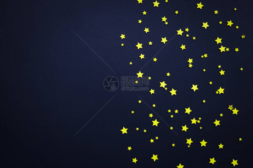 深蓝色背景上的装饰星夜空的概念可用作墙纸或背景图片