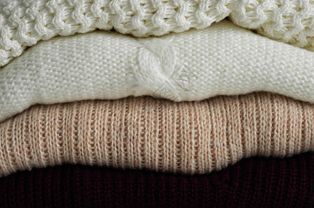 温暖的针织毛衣温暖背景下的针织服装毛衣针织品空图片