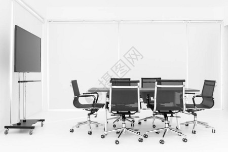 白色会议室桌子周围的一组黑色椅子图片