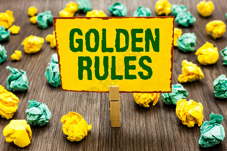 显示黄金法则的概念手写商务照片文本应遵循的基本原则重要原则衣夹黄色便图片