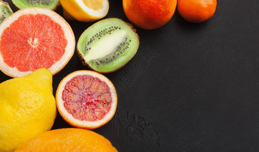 黑色背景的明亮柑橘树果实新鲜的成熟甜美各种异国水图片