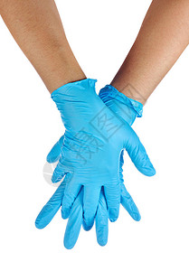戴着蓝色乳胶手套的医生的手图片