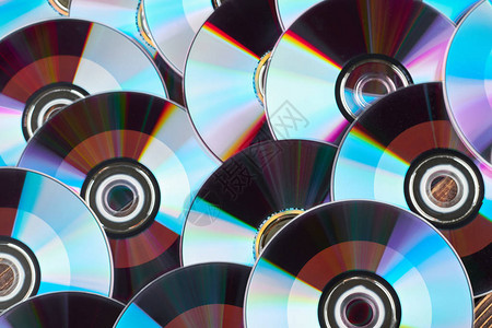 关闭组的DVD光盘彩色光盘背景闪亮的CD图片