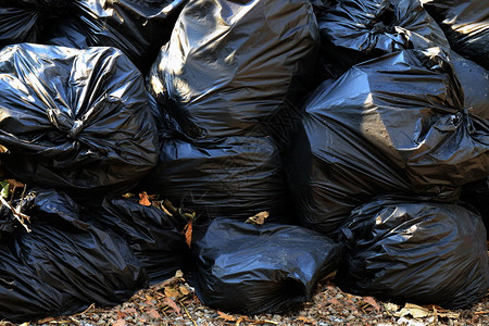 堆废塑料袋许多垃圾特写为背景一堆垃圾塑料黑色污染垃圾塑料垃背景图片