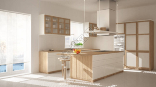 模糊背景室内设计带岛凳子和窗户的现代木质和白色厨房图片
