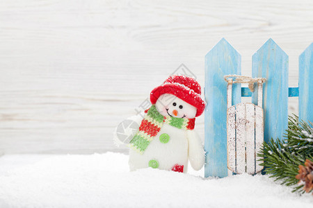 圣诞雪人滑雪玩具和fir枝Xma背景图片