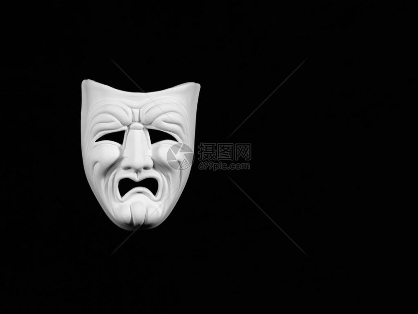 描述悲剧的戏剧面具黑色背景的白面罩无图片