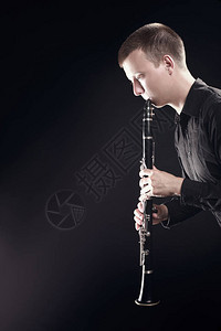 双簧管播放器Clarinet玩家古典音乐家男人演奏乐团背景