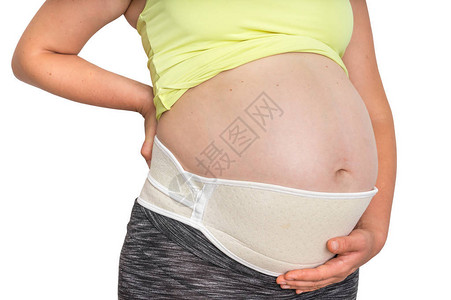 带整形腹部带的孕妇在白发怀孕图片