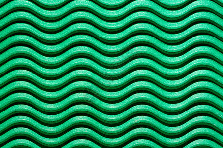 绿色瓦楞纸板中带有光影的波浪线图片