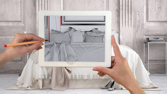 手持和用平板图绘制显示经典卧室的模版背景图片