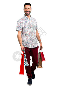 英俊的男人戴着眼镜提着购物袋图片