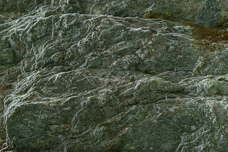背景质地天然旧岩石表面有怪异的皱纹图片