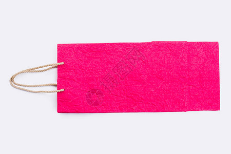 带绳柄的粉红纸购物袋振奋人心的彩色纸礼品图片