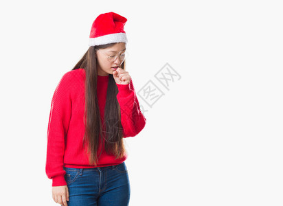 身穿圣诞帽患有寒冷或支气管炎症状的孤立的年轻女子图片
