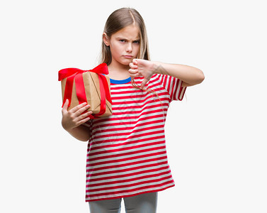 年轻美少女在孤立的背景下提供圣诞节或情人节礼物图片