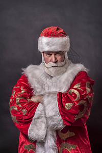 一个年老富豪打扮成圣诞老人和一位灰图片