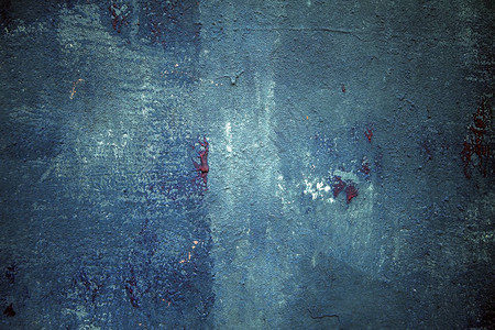 蓝色墙壁纹理与红色油漆滴图片
