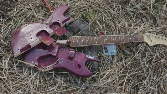 断电吉他部件紫色甲板和枯草底的棕色颈部图片