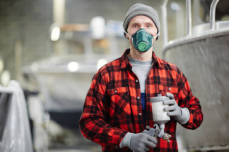 工作服手套和防护面具与有毒和危险混合物作的图片