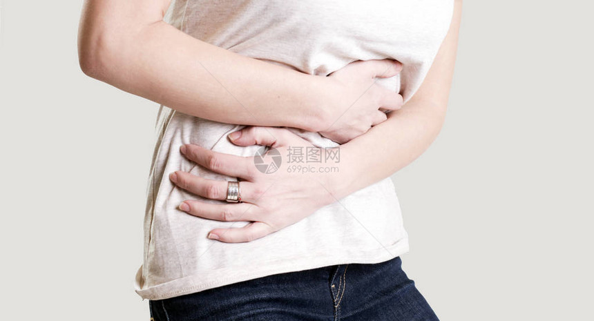 妇女有痛苦的胃痛慢胃图片