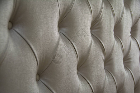 象牙织物软垫家具的质地绗缝纹理的装饰背景灰色布艺沙发图片