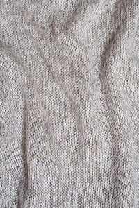 灰色羊毛针织毛衣的质地特写折叠图片