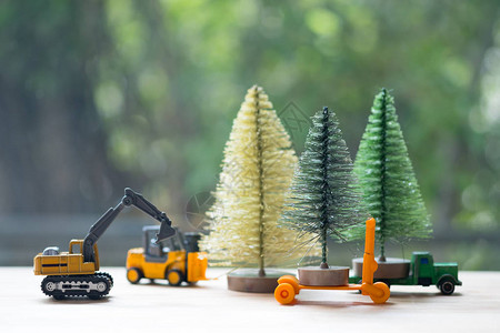 挖掘机玩具模型在季末背景图片