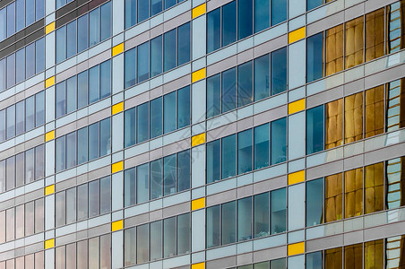 摩天大楼商务中心的特写与蓝天的玻璃商务中心现代办图片