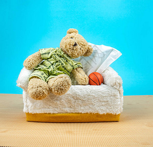 动物篮球素材泰迪熊穿睡衣坐在纸箱上背景