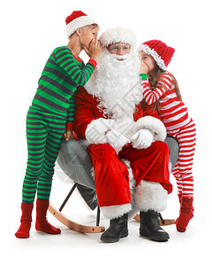 小孩在白人背景下告诉圣诞老人自己的愿望图片
