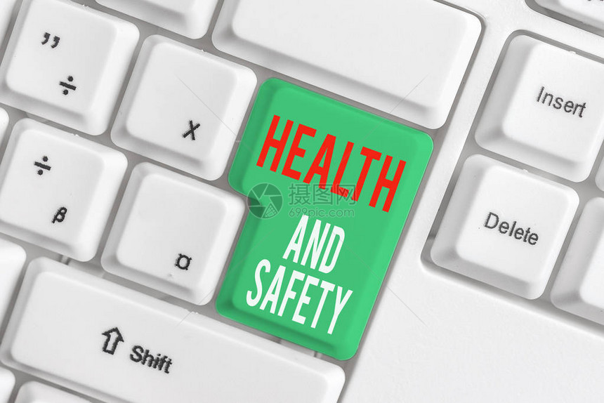 显示健康和安全问题的文字符号商业照片展示旨在防止事故的法规和程序白色pc键盘图片