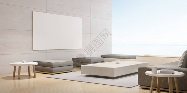 现代豪华客厅与白色沙发和画布相框在轮廓墙上内地设计与大窗的海景背图片